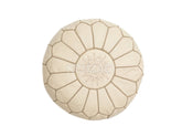 Authentic Moroccan leather pouf with beige embroidery, perfect for adding a bohemian touch to your home décor