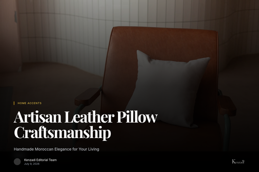 Close-up of a light brown Moroccan leather pillow with traditional stitching on a textured rug in a cozy