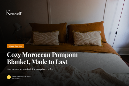 Brown Moroccan handmade pompom blanket draped over a queen bed