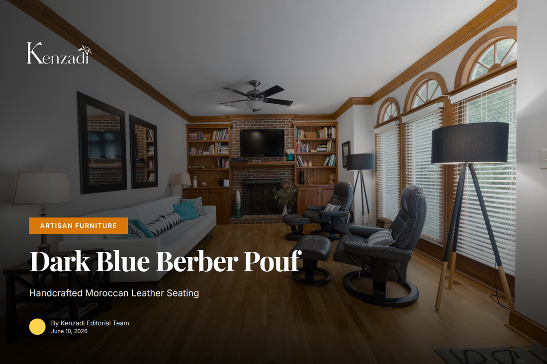 Round dark blue Moroccan leather pouf with blue Berber embroidery displayed in minimalist living room setting