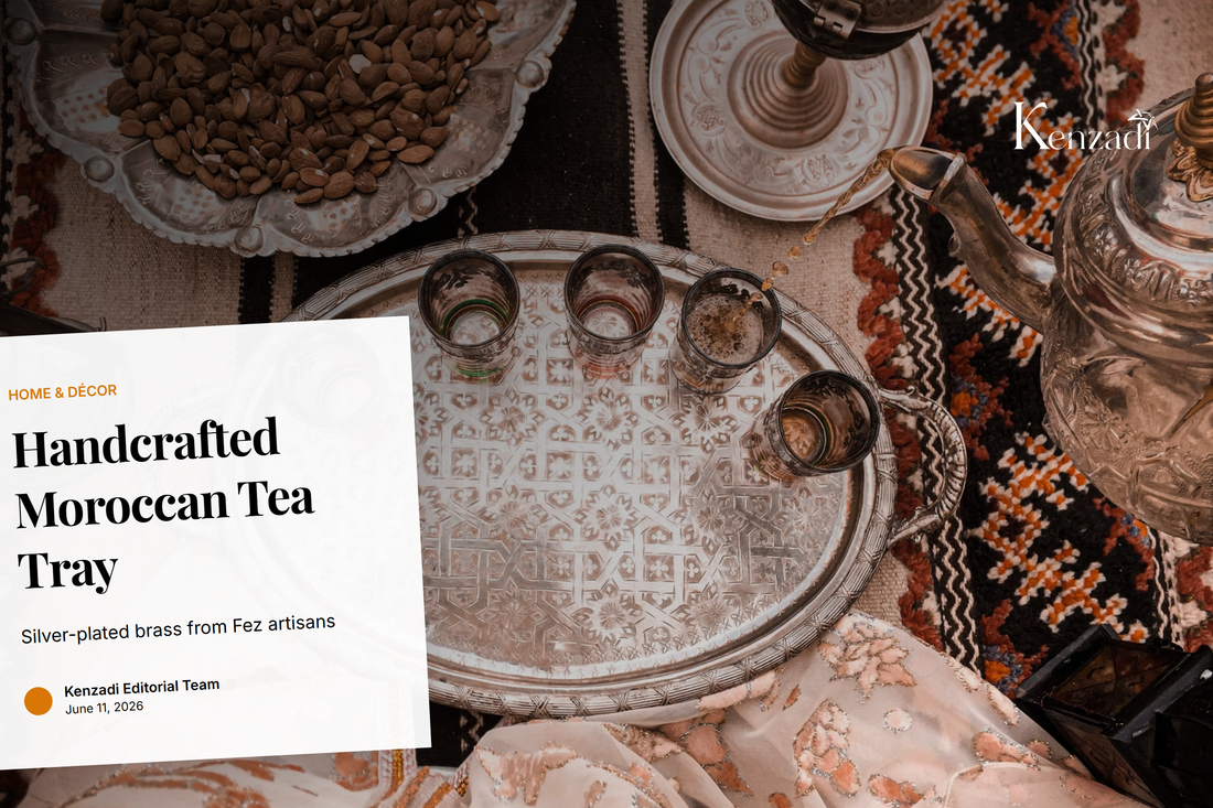 Close-up of a silver-plated brass tea tray with intricate geometric patterns, placed on a wooden table with mint
