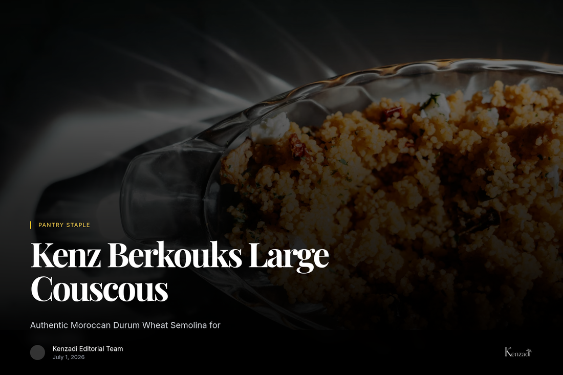 A close-up of golden Berkouks large couscous, or Moroccan pasta, in a white ceramic bowl next to a