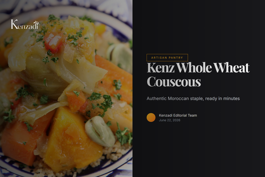 A traditional Moroccan tagine served over a large, steaming platter of fluffy whole wheat couscous, garnished with fresh
