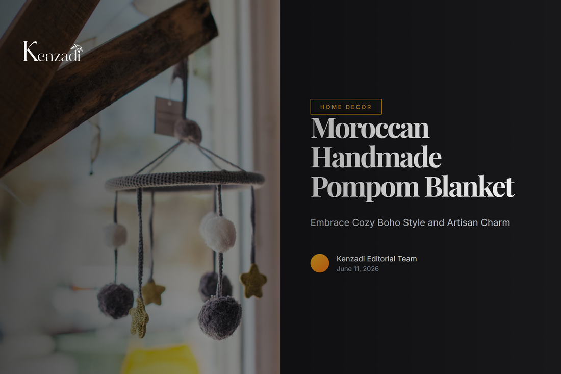 Beautiful grey Moroccan handmade pompom blanket with white pom-poms draped over a bed in a light, airy bedroom.