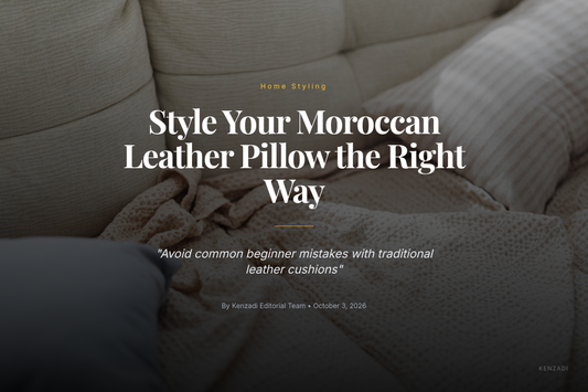 Beige Moroccan leather pillow styled on a couch with woven textiles