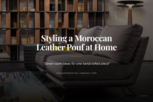 Round silver grey Moroccan leather pouf with grey embroidery styled in a living room