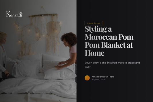 White Moroccan handmade pom pom blanket with brown poms draped over a bed for a boho look