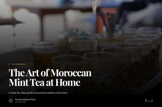 Glass of Moroccan mint tea being poured with Enmer yellow sugar cubes on a tray beside it