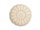 Authentic Moroccan leather pouf with beige embroidery, perfect for adding a bohemian touch to your home décor