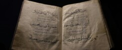 an open book with arabic writing on it