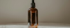 clear glass bottle with brown liquid