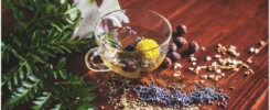 clear tea cup on brown surface