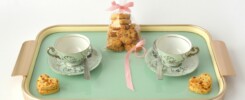 rectangular beige and green tea set and packed cookies