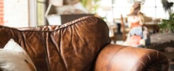 white throw pillow on brown leather armchair